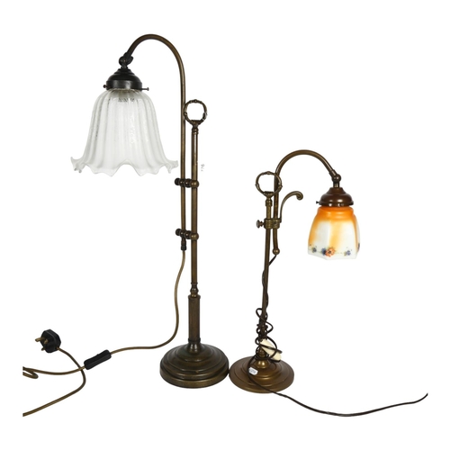 776 - An early 20th century adjustable brass desk lamp with glass shade, and a similar taller desk lamp wi... 