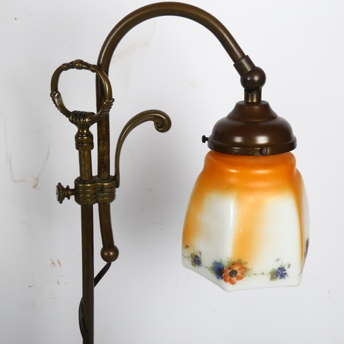 776 - An early 20th century adjustable brass desk lamp with glass shade, and a similar taller desk lamp wi... 