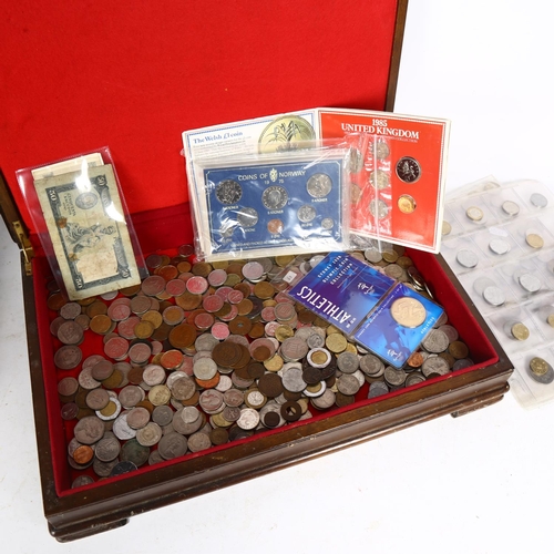 783 - A boxful of world coins, including commemorative items and various banknotes