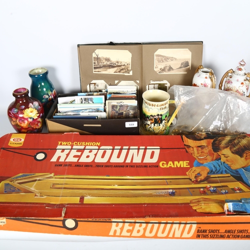 559 - A boxed Rebound game, and a British-made toy rifle, a collection of various Regimental brass buttons... 