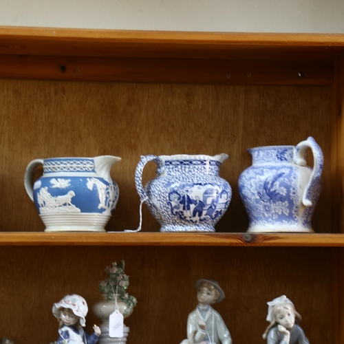 569 - 2 Victorian blue and white jugs and another, 2 large Royal Doulton character jugs - Aramis and Old S... 