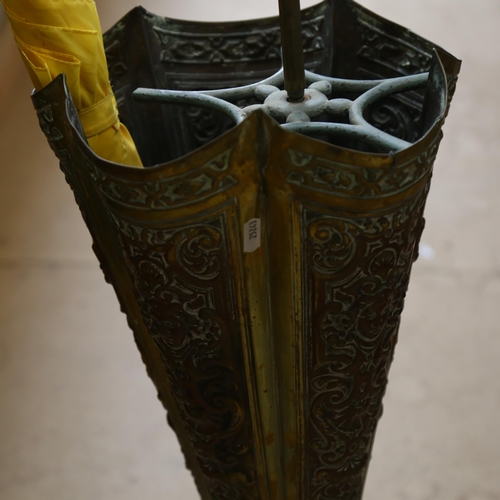 616 - An embossed brass umbrella-shaped stick stand, with 3 umbrellas, H100cm