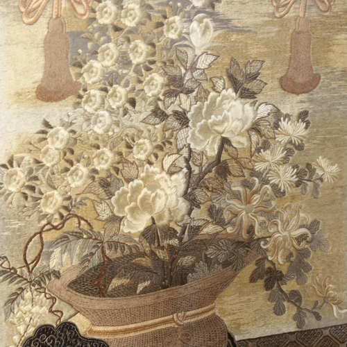 631 - An embroidered and crewelwork panel depicting a cart of flowers, framed, 136 x 86cm