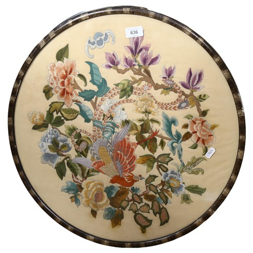 636 - An embroidered Oriental style panel depicting bird and blossom, 54cm