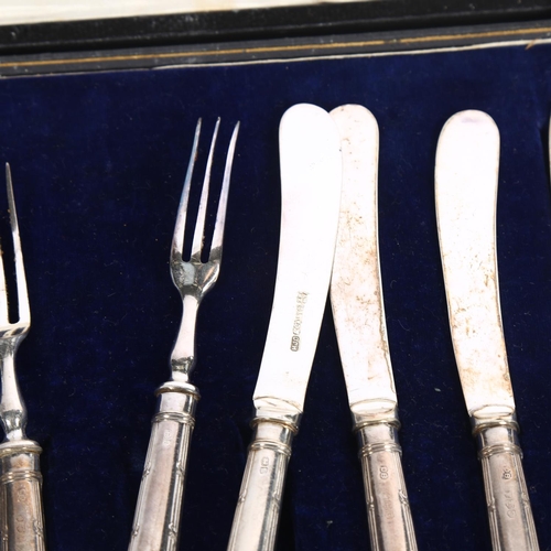 902 - A cased set of silver pistol-grip handled tea knives and forks