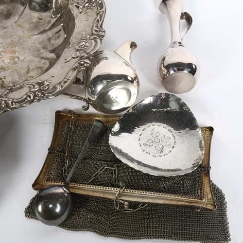 910 - A silver plated table bowl with embossed decoration, a swing-handle basket with scrolled and pierced... 