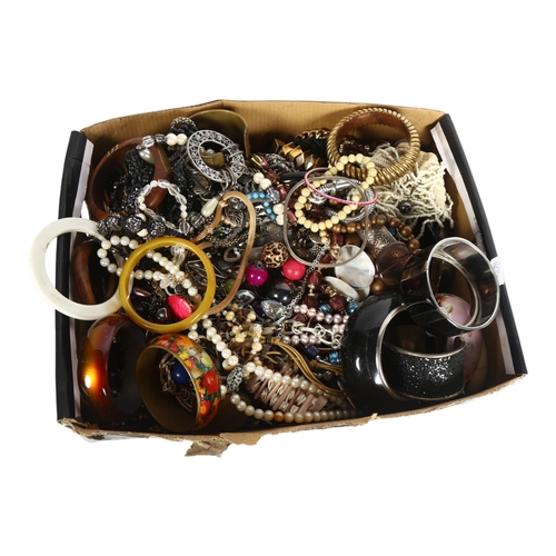 917 - A large collection of modern costume bangles, necklaces etc