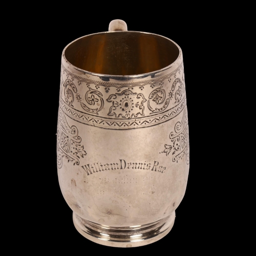 1005 - A Victorian silver christening mug, having allover engraved decoration and named to William Dennis R... 