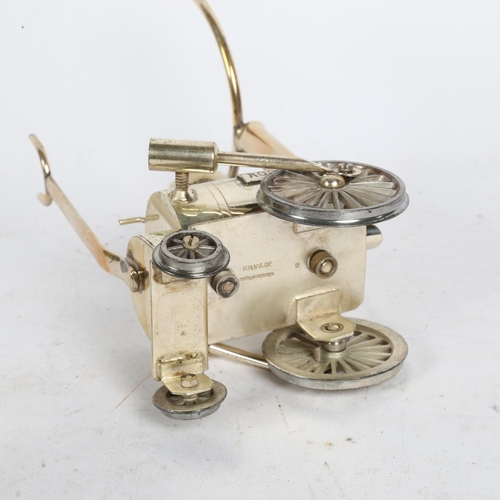 1012 - A silver plated Brandy warmer, in the form of Stephenson's Rocket, height 19.5cm, length 10cm