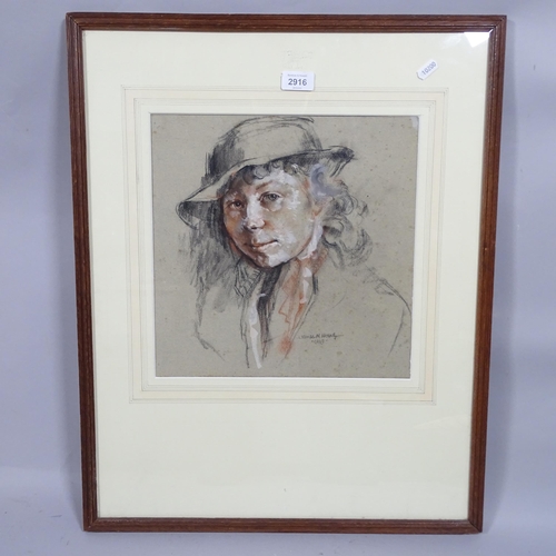 2916 - 20th century British School, portrait of a girl, coloured pastels on grey paper, indistinctly signed... 