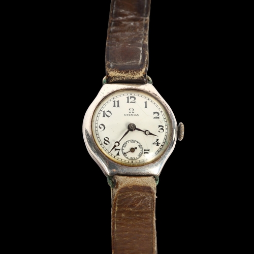 974 - OMEGA - an early 20th century lady's silver mechanical wristwatch, circa 1925, white dial with Arabi... 