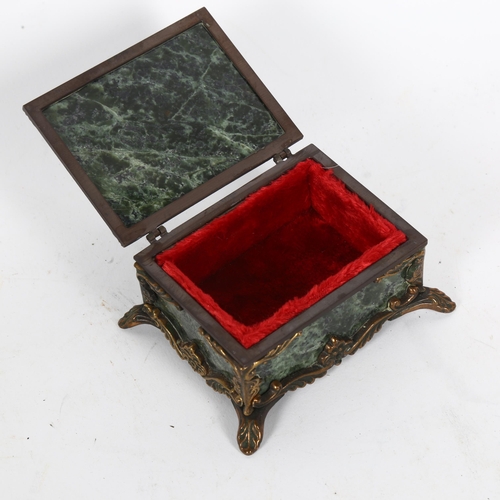 993 - A green hardstone keepsake box, with gilt-metal mounts, red velvet lining