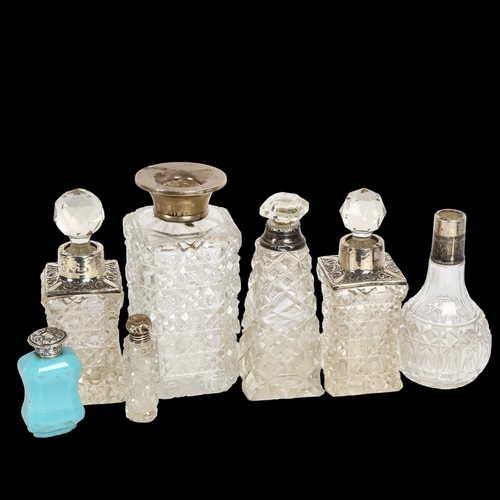 998 - A pair of cut-glass and silver-mounted scent bottles, and 5 other silver-mounted toilet bottles