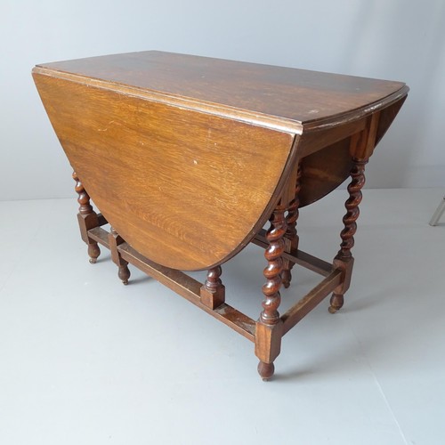 2243 - An antique oak oval barley twist gate-leg table. 108x77x52cm (extending to 146cm).