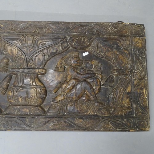 2702 - An Eastern carved hardwood wall panel, depicting lovers in embrace. 183x46x4cm