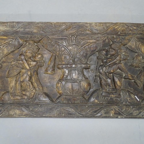 2702 - An Eastern carved hardwood wall panel, depicting lovers in embrace. 183x46x4cm