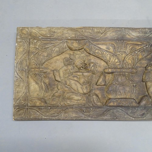 2702 - An Eastern carved hardwood wall panel, depicting lovers in embrace. 183x46x4cm