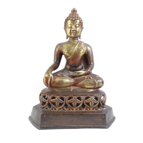 514 - A bronze seated Buddha on pierced foliate plinth, H41cm