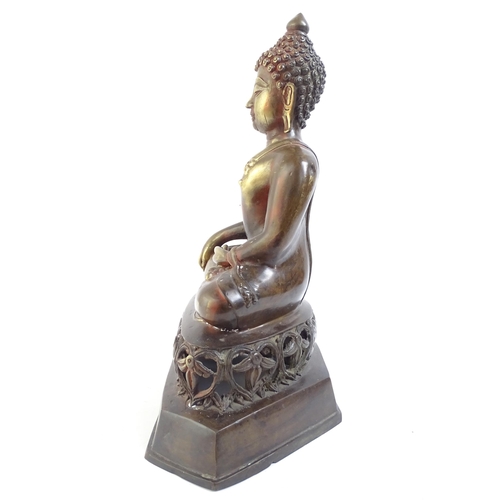 514 - A bronze seated Buddha on pierced foliate plinth, H41cm