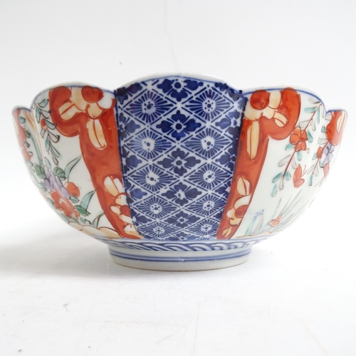 734 - A Chinese blue and white jardiniere, H17.5cm, Imari bowl, ginger jar, and a pot decorated with butte... 