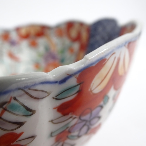 734 - A Chinese blue and white jardiniere, H17.5cm, Imari bowl, ginger jar, and a pot decorated with butte... 