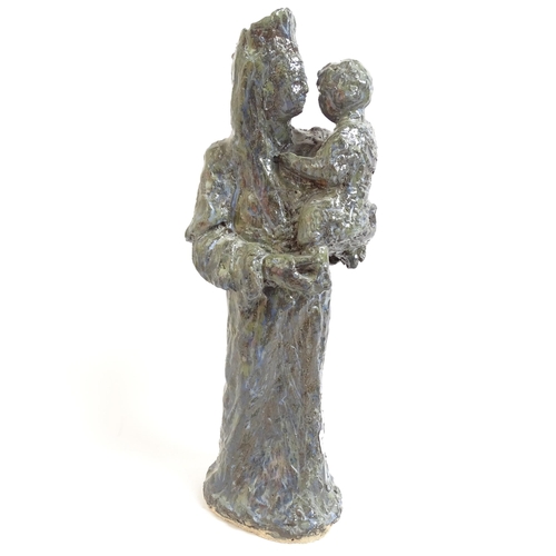 742 - A carved wood sculpture of St Joseph, H27cm, a glazed Studio pottery Madonna and child, and a religi... 