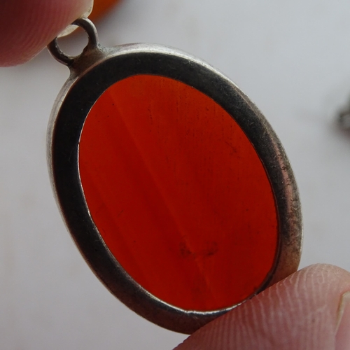 925 - A Victorian relief carved cameo in gilt-metal mount, and a Victorian hair panel mourning brooch