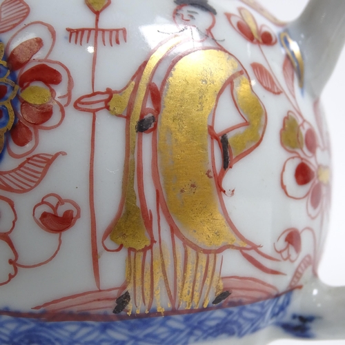 565 - A Chinese porcelain teapot with painted and gilded figure and building design, H11cm, and an Imari p... 