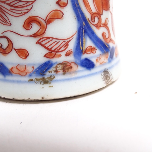 565 - A Chinese porcelain teapot with painted and gilded figure and building design, H11cm, and an Imari p... 