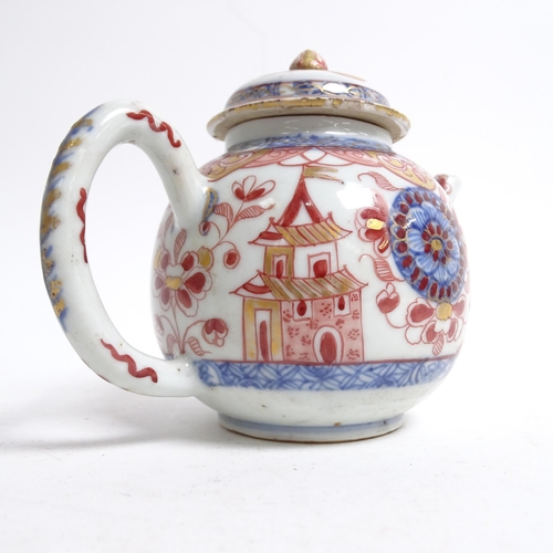 565 - A Chinese porcelain teapot with painted and gilded figure and building design, H11cm, and an Imari p... 