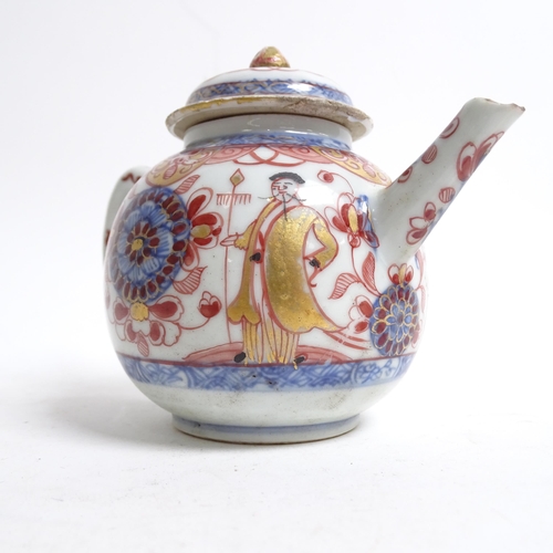 565 - A Chinese porcelain teapot with painted and gilded figure and building design, H11cm, and an Imari p... 