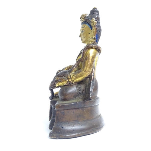 135 - A small Tibetan patinated bronze Jambhala, H9cm