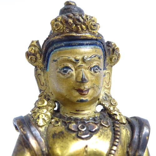 135 - A small Tibetan patinated bronze Jambhala, H9cm