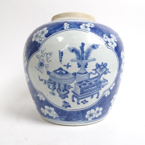 334 - A Chinese blue and white ginger jar and cover, with panels of interior designs on prunus ground, H22... 