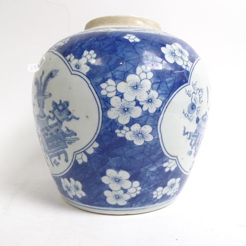 334 - A Chinese blue and white ginger jar and cover, with panels of interior designs on prunus ground, H22... 