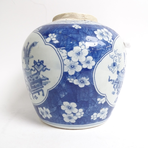 334 - A Chinese blue and white ginger jar and cover, with panels of interior designs on prunus ground, H22... 