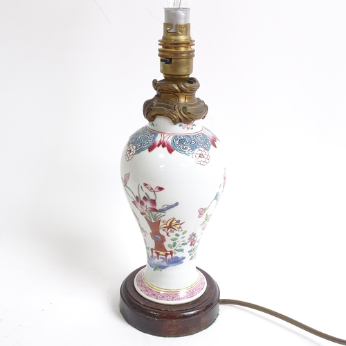 337 - An Oriental porcelain green ground table lamp, with enamelled decoration, and shade, 51cm, and a sma... 