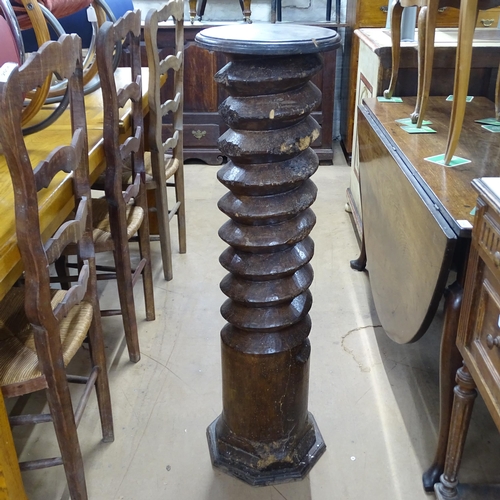 2063 - A French elm spiral turned column with circular top, on octagonal base. 30 x 110cm.