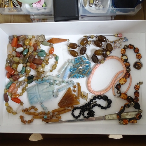 914 - A large collection of costume jewellery, coral necklaces, jade bangles, wristwatches etc