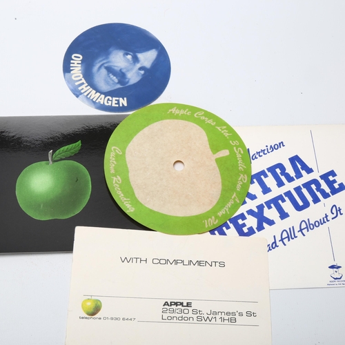 13 - Beatles Interest - a collection of 1970s' Apple memorabilia, including postcard, turntable centre, c... 