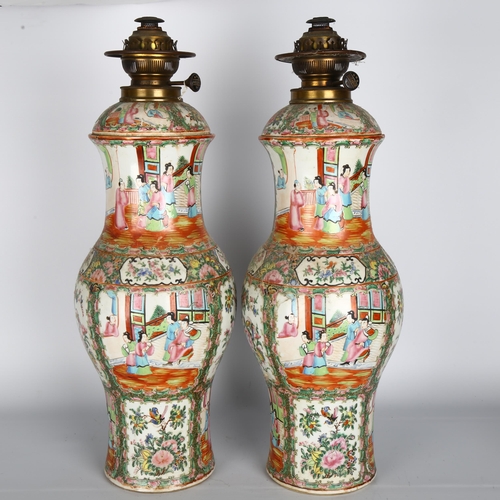 20 - A pair of large Chinese Canton famille rose ceramic baluster oil lamps, with hand painted and enamel... 