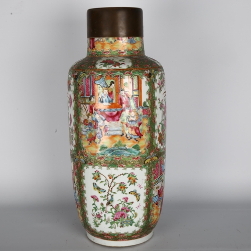 21 - A large Chinese Canton famille rose ceramic vase, with hand painted and enamelled figures in courtya... 