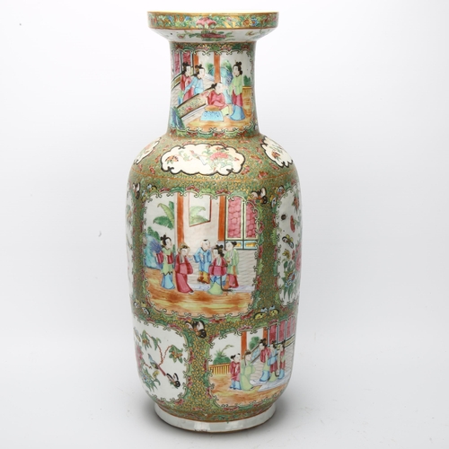 22 - A Chinese Canton famille rose ceramic rouleau vase, with hand painted and enamelled figures in court... 