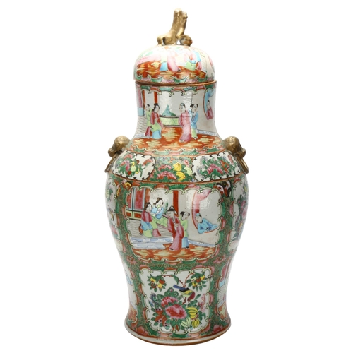 23 - A Chinese Canton famille rose vase and cover, with hand painted and enamelled figures in courtyard a... 