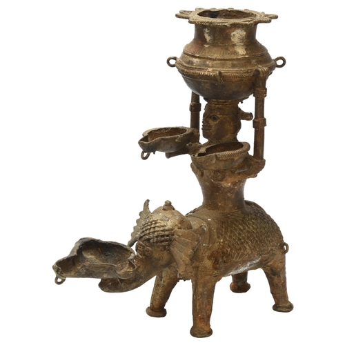 3 - An early 19th century Basar tribal oil lamp depicting Lakshmi, Goddess of Light on a elephant carryi... 