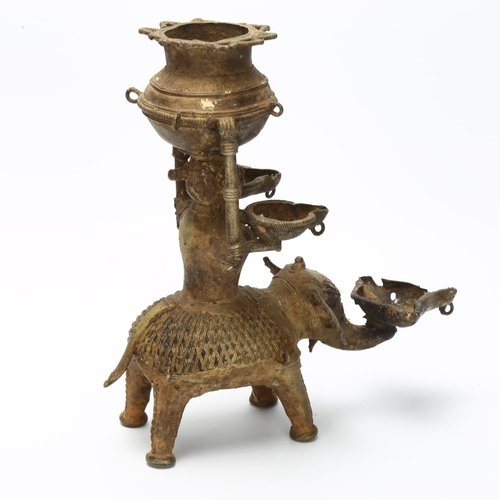 3 - An early 19th century Basar tribal oil lamp depicting Lakshmi, Goddess of Light on a elephant carryi... 