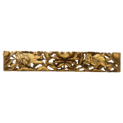 7 - A 19th century carved gilt gesso panel of Chinese Foo Dogs and central flower, length 62cm