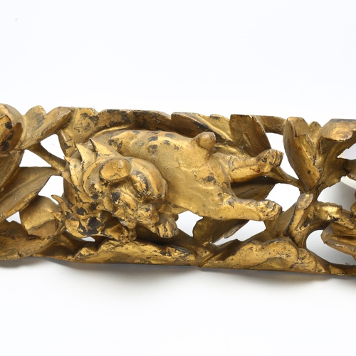 7 - A 19th century carved gilt gesso panel of Chinese Foo Dogs and central flower, length 62cm