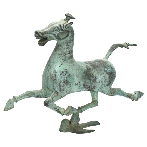 106 - A Tang style hollow bronze patinated horse, height 25cm