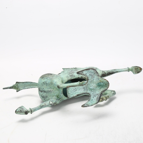 106 - A Tang style hollow bronze patinated horse, height 25cm